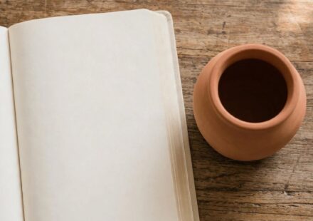 A plain clay jar beside an open Bible, representing an ordinary, struggling person still genuinely qualified to lead and teach.